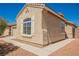 Close up of home with an arched window, and a walkway at 909 Trinity Pond Cir, Henderson, NV 89002