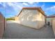 View of the backyard with a gravel area and rear exterior of the home at 9146 Grand Sunburst Ct, Las Vegas, NV 89149