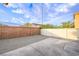 Fenced backyard with concrete and gravel landscaping at 9146 Grand Sunburst Ct, Las Vegas, NV 89149
