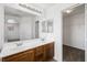 Dual sink bathroom showcasing modern fixtures, ample counter space, and generous lighting at 9146 Grand Sunburst Ct, Las Vegas, NV 89149