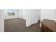 Bedroom featuring carpet flooring, neutral walls, and ample natural light from a large window at 9146 Grand Sunburst Ct, Las Vegas, NV 89149