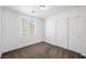 Comfortable bedroom with natural light, plush carpet, and a large closet at 9146 Grand Sunburst Ct, Las Vegas, NV 89149