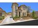 Charming two-story home with a well-manicured front yard and neutral stucco exterior at 9146 Grand Sunburst Ct, Las Vegas, NV 89149
