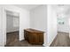 Upstairs hallway nook featuring a built-in storage cabinet with soft carpet at 9146 Grand Sunburst Ct, Las Vegas, NV 89149