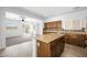 Open concept kitchen featuring wood cabinets, granite countertops, and stainless steel appliances at 9146 Grand Sunburst Ct, Las Vegas, NV 89149