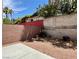 A cozy backyard space with mature landscaping and a block wall at 9165 Beauchamp Ave, Las Vegas, NV 89148