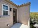 Balcony with door and window overlooking lush greenery, offering a relaxing outdoor space at 9165 Beauchamp Ave, Las Vegas, NV 89148