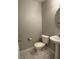 Clean half-bathroom features tiled flooring and stylish pedestal sink at 9165 Beauchamp Ave, Las Vegas, NV 89148