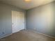 Bedroom featuring neutral walls and carpet, providing a serene and cozy atmosphere at 9165 Beauchamp Ave, Las Vegas, NV 89148
