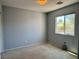 Bedroom featuring neutral walls and carpet, complemented by a window letting in natural light at 9165 Beauchamp Ave, Las Vegas, NV 89148