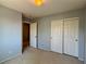 Bedroom featuring neutral walls and carpet, with a closet offering lots of storage space at 9165 Beauchamp Ave, Las Vegas, NV 89148