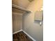 Under-stairs storage closet with wood-look flooring and utility panel at 9165 Beauchamp Ave, Las Vegas, NV 89148