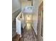 Inviting entryway with wood-look flooring, staircase, and neutral paint at 9165 Beauchamp Ave, Las Vegas, NV 89148