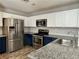 Stylish kitchen featuring stainless steel appliances and granite countertops at 9165 Beauchamp Ave, Las Vegas, NV 89148