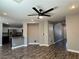 Open living space with wood flooring and a modern ceiling fan at 9165 Beauchamp Ave, Las Vegas, NV 89148