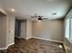 Spacious living room showcasing modern wood-look floors, ceiling fan, and natural light at 9165 Beauchamp Ave, Las Vegas, NV 89148