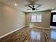 Spacious living room showcasing modern wood-look floors, ceiling fan, and natural light at 9165 Beauchamp Ave, Las Vegas, NV 89148