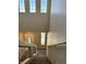 Bright staircase leading to the upper level with carpeted steps and large windows for natural light at 9165 Beauchamp Ave, Las Vegas, NV 89148