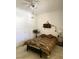 Cozy bedroom featuring a ceiling fan, a decorative dream catcher, a Southwestern-style bedspread, and natural light at 9470 Peace Way # 212, Las Vegas, NV 89147
