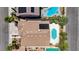 Aerial view of a home featuring a backyard pool, patio, solar panels, and mature landscaping at 9632 Cherry Canyon Ave, Las Vegas, NV 89129