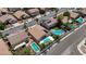 This aerial view shows several houses with swimming pools in a residential neighborhood at 9632 Cherry Canyon Ave, Las Vegas, NV 89129