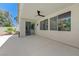 Covered patio with ceiling fan, offering a relaxing outdoor space and pool view at 9632 Cherry Canyon Ave, Las Vegas, NV 89129