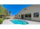 Backyard showcasing a sparkling pool and a covered patio area at 9632 Cherry Canyon Ave, Las Vegas, NV 89129