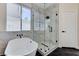 Modern bathroom featuring a standalone tub, glass-enclosed shower, and stylish fixtures at 9632 Cherry Canyon Ave, Las Vegas, NV 89129
