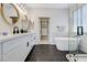 Bright bathroom with double vanity, soaking tub, and walk-in shower at 9632 Cherry Canyon Ave, Las Vegas, NV 89129