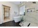 Elegant bathroom with free-standing tub, walk-in shower with glass enclosure, and stylish black fixtures at 9632 Cherry Canyon Ave, Las Vegas, NV 89129