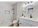 Modern bathroom with a walk-in shower, vanity, and decorative mirror at 9632 Cherry Canyon Ave, Las Vegas, NV 89129