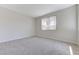 Bright bedroom with plush carpet and a large window at 9632 Cherry Canyon Ave, Las Vegas, NV 89129