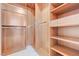 Spacious walk-in closet with adjustable shelving and chrome closet rods at 9632 Cherry Canyon Ave, Las Vegas, NV 89129