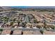 An aerial shot of closely-packed homes in a suburban neighborhood under a clear sky at 9632 Cherry Canyon Ave, Las Vegas, NV 89129