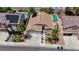 Aerial view of a well-maintained home with mature landscaping, a spacious driveway, and a welcoming entrance at 9632 Cherry Canyon Ave, Las Vegas, NV 89129