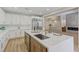 Modern kitchen with large island, stainless steel appliances, and white cabinetry at 9632 Cherry Canyon Ave, Las Vegas, NV 89129