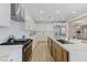 Spacious kitchen showcasing white cabinets, stainless steel appliances, and a large island with a sink at 9632 Cherry Canyon Ave, Las Vegas, NV 89129
