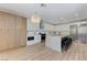 Spacious kitchen featuring custom cabinets, stainless steel appliances, and a modern island with seating at 9632 Cherry Canyon Ave, Las Vegas, NV 89129