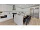 Modern kitchen featuring white cabinets, stainless steel appliances, and a large center island with bar seating at 9632 Cherry Canyon Ave, Las Vegas, NV 89129