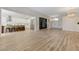 Expansive living room showcasing the kitchen, contemporary shelving, and front entrance at 9632 Cherry Canyon Ave, Las Vegas, NV 89129
