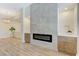 Open living room featuring a tiled fireplace and built-in cabinets and shelves at 9632 Cherry Canyon Ave, Las Vegas, NV 89129