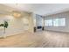 Spacious living room with light wood floors, modern fireplace, and views into other rooms at 9632 Cherry Canyon Ave, Las Vegas, NV 89129