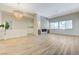 Spacious living room with stylish chandelier, fireplace, and abundant natural light at 9632 Cherry Canyon Ave, Las Vegas, NV 89129