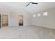 Spacious main bedroom with neutral carpet, ceiling fan and ensuite bathroom at 9632 Cherry Canyon Ave, Las Vegas, NV 89129