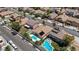 Aerial view of a suburban neighborhood featuring diverse homes, landscaping, and orderly street patterns at 9632 Cherry Canyon Ave, Las Vegas, NV 89129