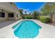 Sparkling private pool surrounded by lush landscaping in the backyard at 9632 Cherry Canyon Ave, Las Vegas, NV 89129