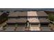 Aerial view showcases townhome's tile roof, paired garages, and hardscape against mountain backdrop at , Henderson, NV 89044