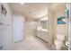 Bright bathroom with tile floors, glass shower doors and white vanity at , Henderson, NV 89044