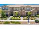 Charming townhome with stone accents, lush landscaping, and a welcoming entrance at , Henderson, NV 89044