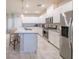 Well-lit kitchen with white cabinets, stainless steel appliances, and granite countertops at , Henderson, NV 89044